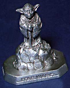 A picture of a pewter Yoda figurine