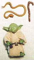 The old Yoda toy out of the package with accessories