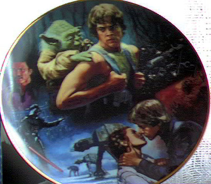 A Empire Strikes Back plate with Yoda on Luke's back and other images from the movie