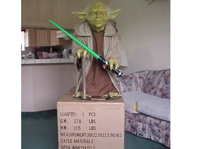 Episode I Yoda replica with a lightsaber