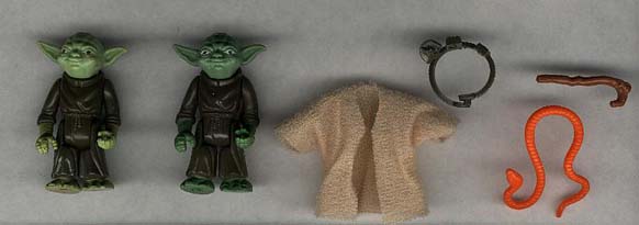Two vintage Yoda figures with accessories