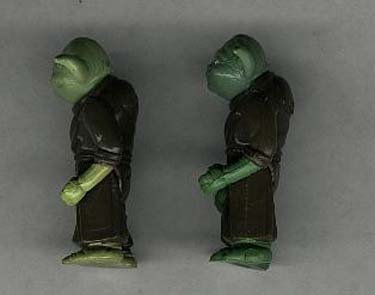 Side view of two vintage Yoda figures