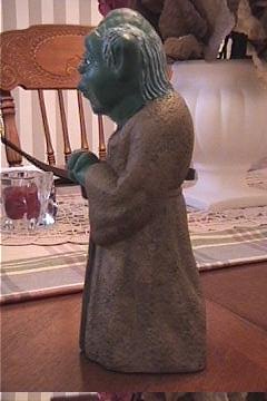 Left view of a vintage Mexican Yoda bank