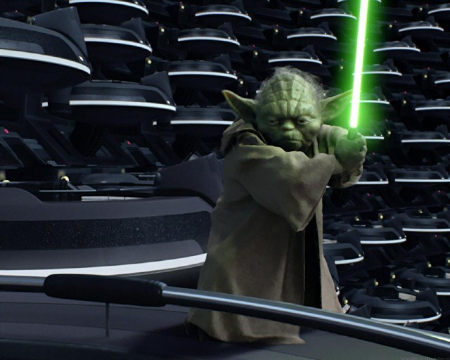 Yoda with his lightsaber drawn in the Senate