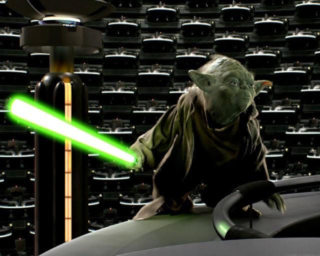 Yoda with his lightsaber, ready to jump from the Senate pod