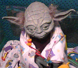 A picture of a Yoda replica in pajamas