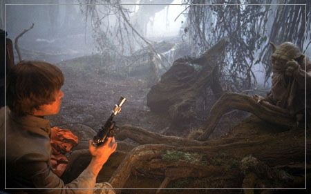 Luke draws his gun on Yoda