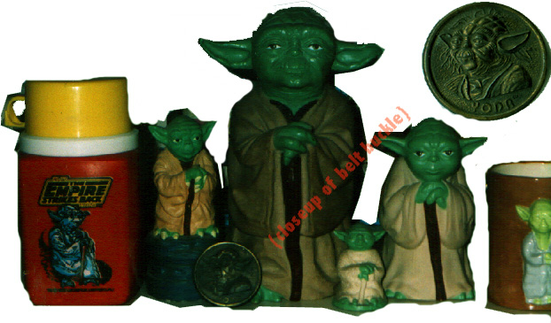 A bunch of Yoda collectibles