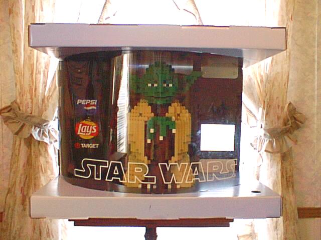 Lego Yoda in his display case