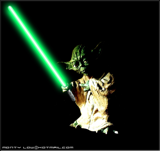 Yoda with green lightsaber