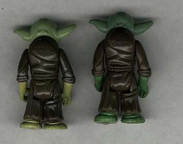 Back view of two vintage Yoda figures