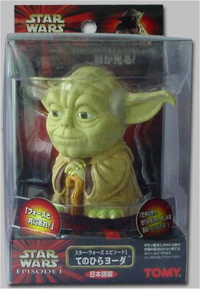 Japanese speaking Tomy Yoda palm talker (front view - in package)