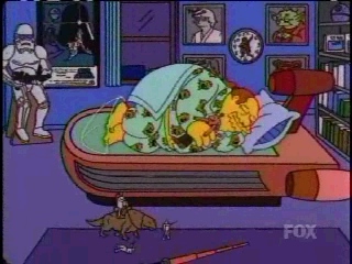 Comic Book Guy from The Simpsons with a Yoda picture on his wall