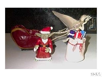 Deluxe custom Yoda Claus figure standing next to his sleigh