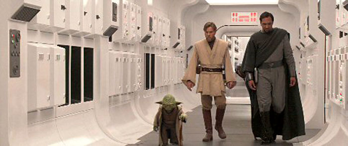 Yoda, Obi-Wan, and Bail Organa walking down the blockade runner hallway