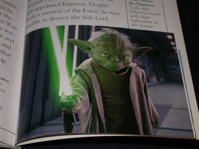 Yoda with his lightsaber